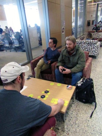 Rob Blunier, Sophomore (top left), Zane Sarafiny, Freshman (bottom left), and Geoffrey Wing, Senior (top right) play a card game in the Bio-Science building to pass the time and bond as friends. Thursday, February 23, 2017.